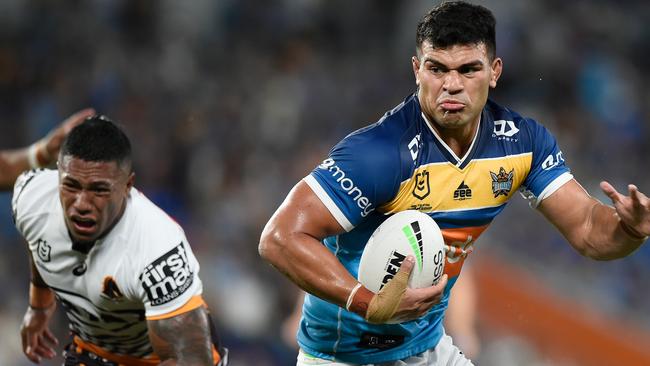 GOLD COAST, AUSTRALIA - MARCH 19: David Fifita of the Titans makes a break and scores a try during the round two NRL match between the Gold Coast Titans and the Brisbane Broncos at Cbus Super Stadium on March 19, 2021, in Gold Coast, Australia. (Photo by Matt Roberts/Getty Images)