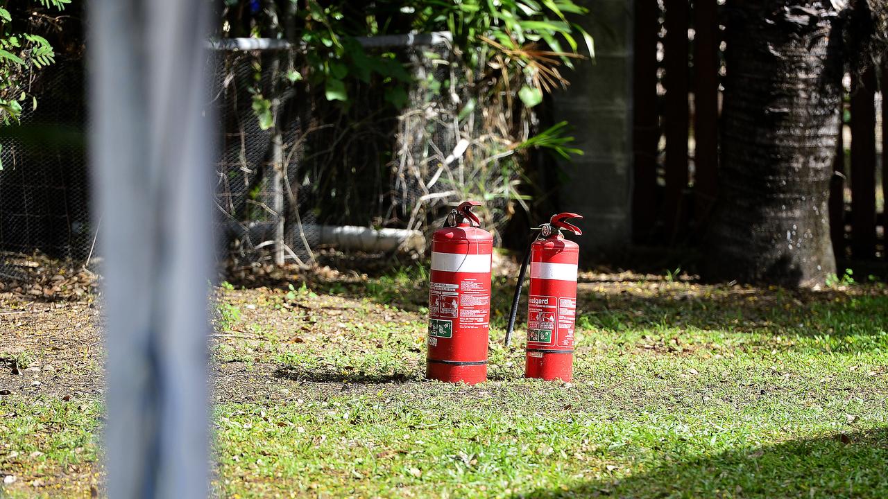 Fire extinguishers outside the house on Cluden which caught fire. PICTURE: MATT TAYLOR.