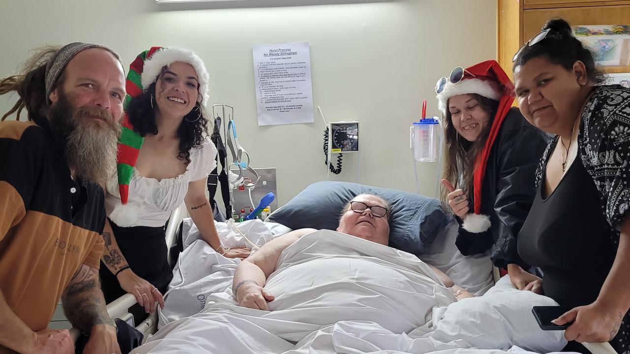 Wendy Gillingham-Scott surrounded by her husband Mick and their three daughters at Christmas.