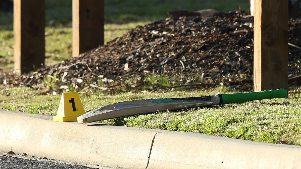 A cricket bat was lying on the ground on Wednesday morning at the scene. Picture: Alan Barber