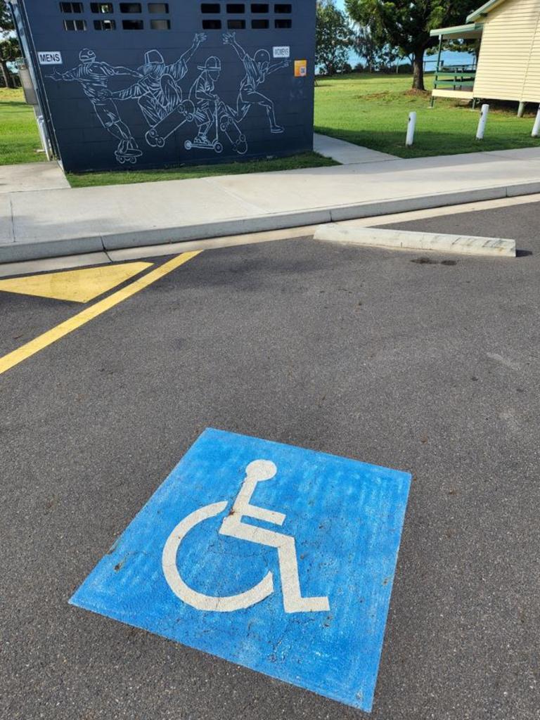 The disability parking space next to the public amenities at Emu Park near the boat ramp.