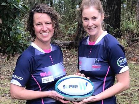 CFA people and culture executive director Liz Radcliffe (left) with CFA deputy chief officer Stephanie Rotarangi in rugby gear.