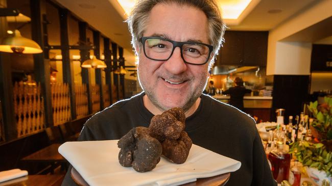 Guy Grossi with a handful of truffles at Florentinos. Picture: Jay Town