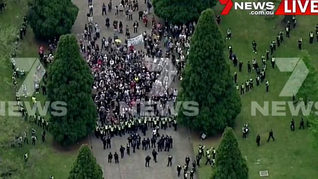 Police formed a ring around the protesters. Picture: 7 News