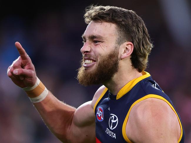 ADELAIDE, AUSTRALIA - AUG 11: Riley Thilthorpe of the Crows celebrates a goal during the 2024 AFL Round 22 match between the Adelaide Crows and the Western Bulldogs at Adelaide Oval on August 11, 2024 in Adelaide, Australia. (Photo by Sarah Reed/AFL Photos via Getty Images)