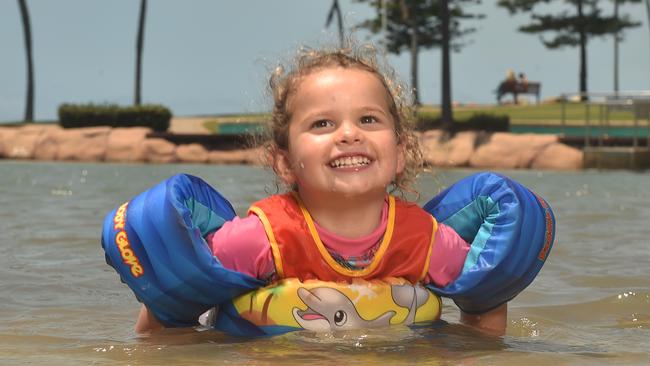 Lily Mansey, 2, from the Sunshine Coast practices her turtle swimming at the rock pool on the Strand. Picture: Evan Morgan