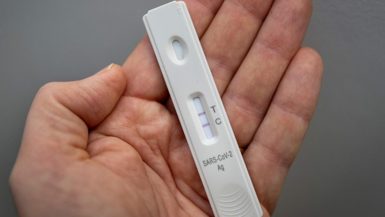 A used rapid antigen test, also known as a lateral flow test showing a positive test result for the Covid-19 coronavirus. Picture: Odd Andersen/AFP