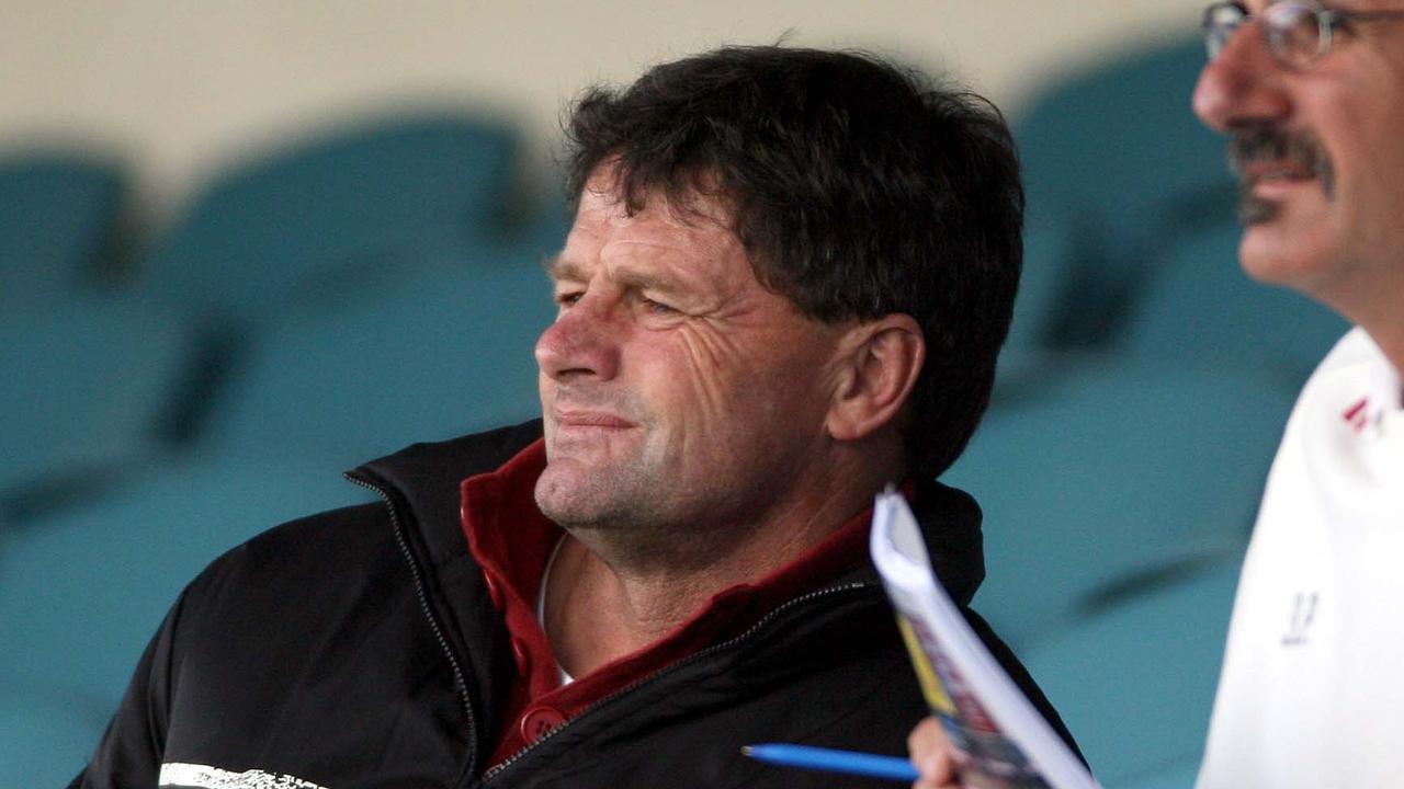 Former Port Adelaide Power assistant coach Geoff Morris (l) who now works for Hawthorn, sitting in stands during Port Adelaide Power training at AAMI Stadium.