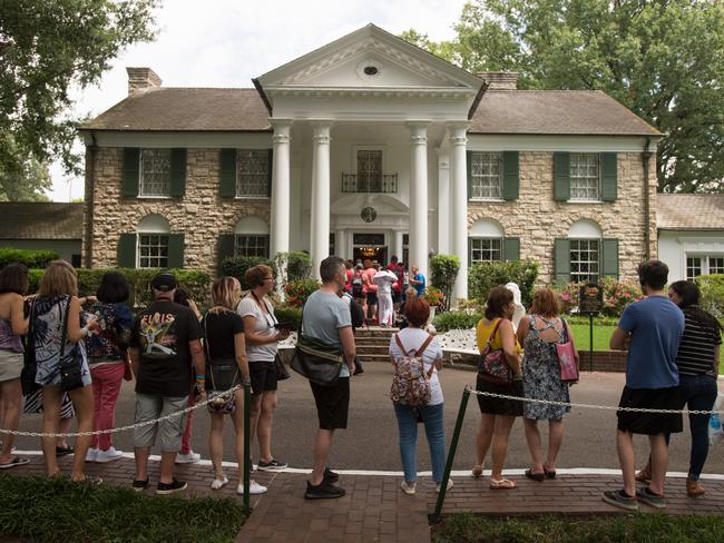 Fans queuing up outside Graceland waiting to tour the Memphis home of Elvis Presley ahead of the candlelight vigil marking 40 years since the singer died. Picture: AP