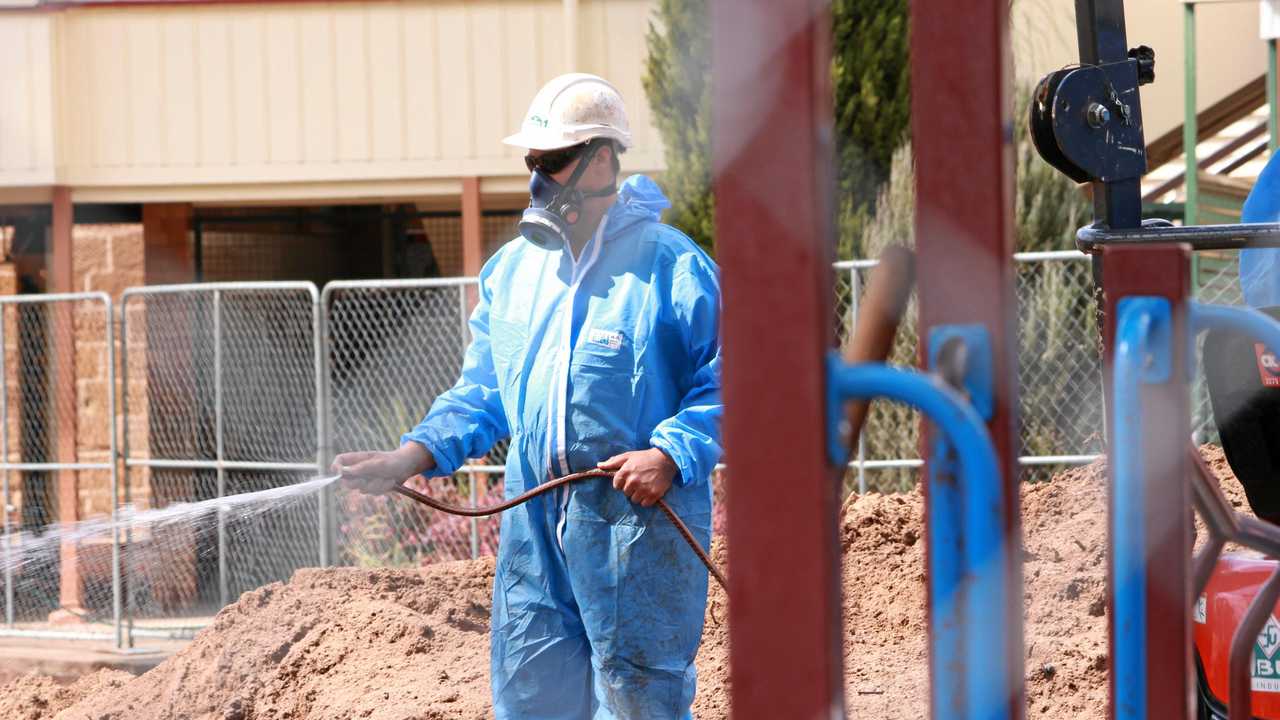 Asbestos removalists are digging up the oval and playgrounds of Warwick Central State School in a bid to give parents, students and staff peace of mind after asbestos was found in the grounds. Picture: Marian Faa