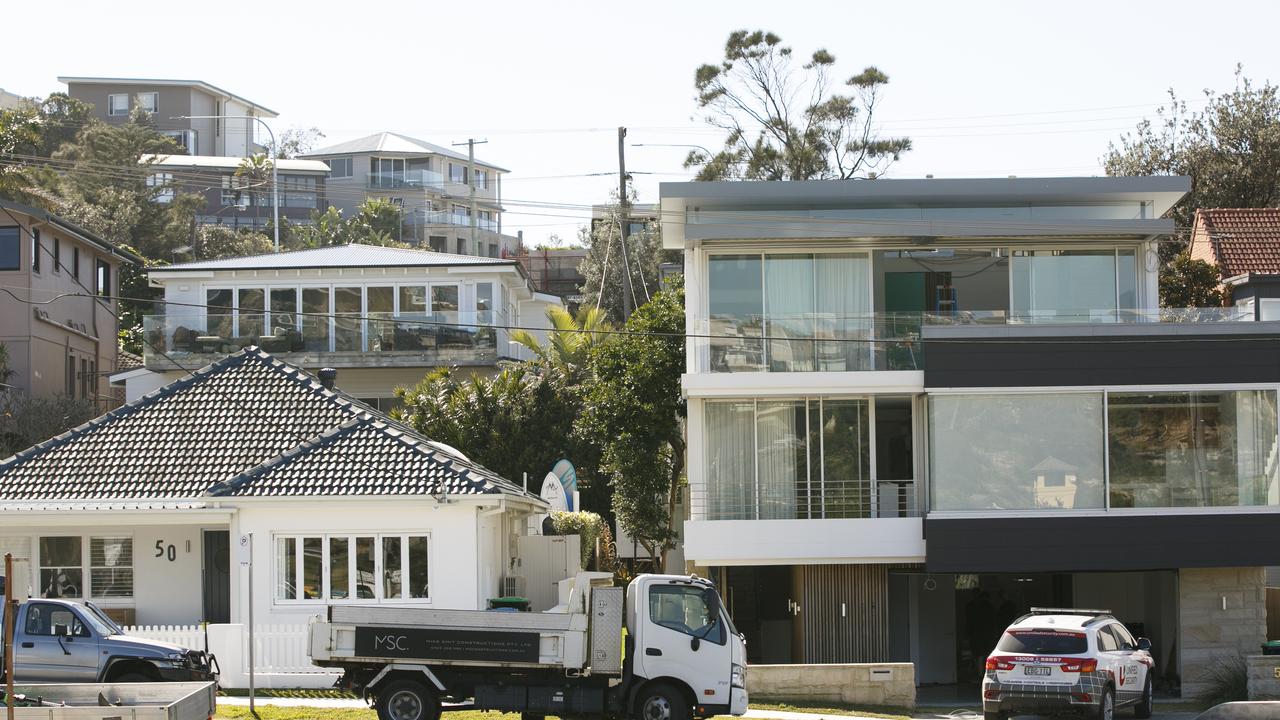 F45 co-founder Adam Gilchrist paid $5.4 million for the cottage on the left, then $14 million for his neighbour’s modern home on the right. AAP IMAGE/ Tim Pascoe