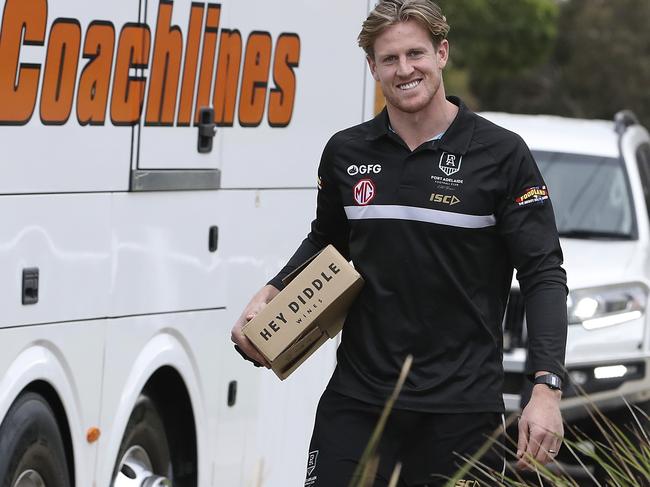 Port Adelaide’s captain Tom Jonas boards a bus heading to the Adelaide Airport before they base themselves in the AFL Queensland Hub due to Corvid-19. Picture: Sarah Reed