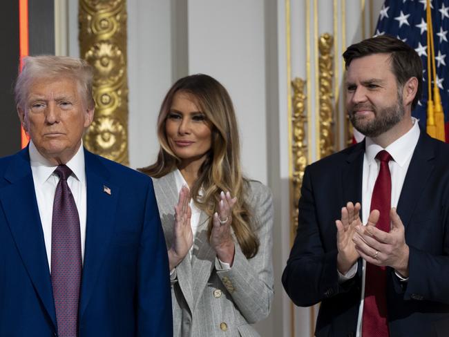 President-elect Donald Trump, from left, Melania Trump and Vice President-elect JD Vance stand at a TIME magazine Person of the Year ceremony at the New York Stock Exchange. Picture: AP