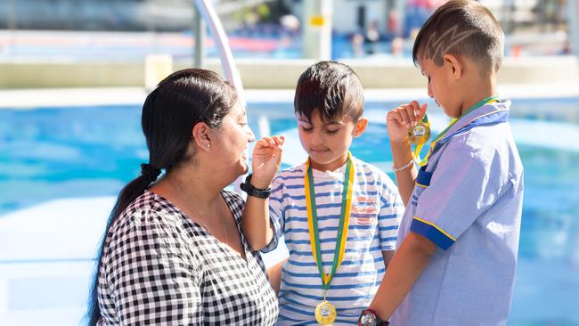 Tegh and Rabbi Virdi, with their mother, show off their Kids Alive gold medals. Picture: Contributed