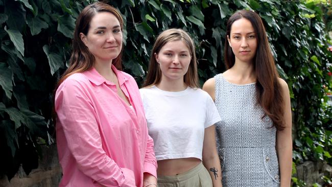 Kateryna Odarushenko, 36, left, her sister Yelyzaveta "Liza" Komar, 24, centre, and Australian Federation of Ukrainian Organisations co-chair Kateryna Argyrou. Picture: James Dowling