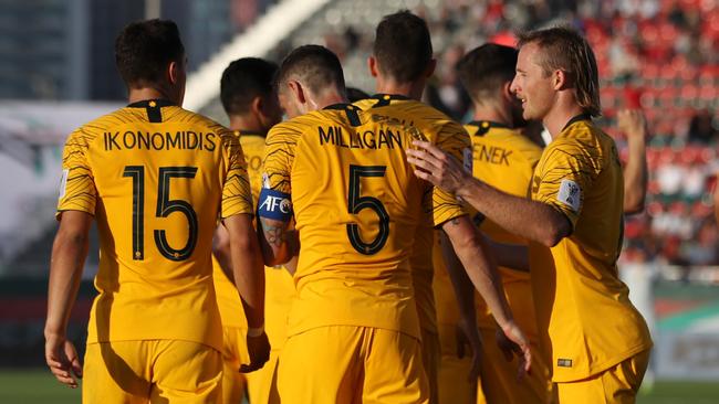 DUBAI, UNITED ARAB EMIRATES - JANUARY 11:  Apostolos Giannou of Australia (hidden) celebrates with team mates after scoring their team's third goal during the AFC Asian Cup Group B match between Palestine and Australia at Rashid Stadium on January 11, 2019 in Dubai, United Arab Emirates. (Photo by Francois Nel/Getty Images)