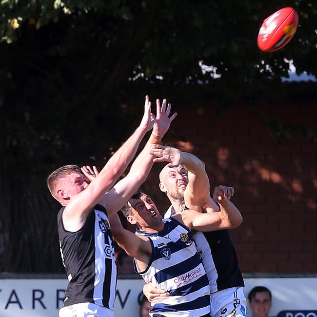 Wangaratta coach Ben Reid, right, arrives late to spoil. Picture: Yuri Kouzmin