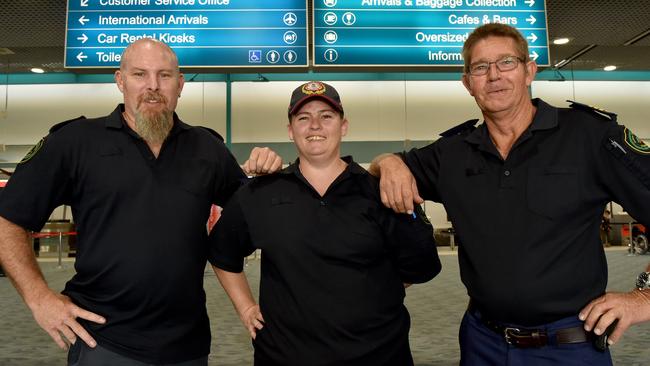 Rural fire fighters David Redsell from Abbot Point, Kimberleigh Smith from Mt Isa and Bernard van der Dolder from Bluewater at Townsville Airport. Picture: Evan Morgan