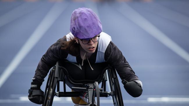 Wearing plenty of protective clothing to combat the rain Sarah Clifton-Bligh contested the 400m wheelchair heat.