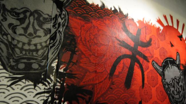 The mural, created by Paul Shanta, features the Chinese symbol for the Too’s.