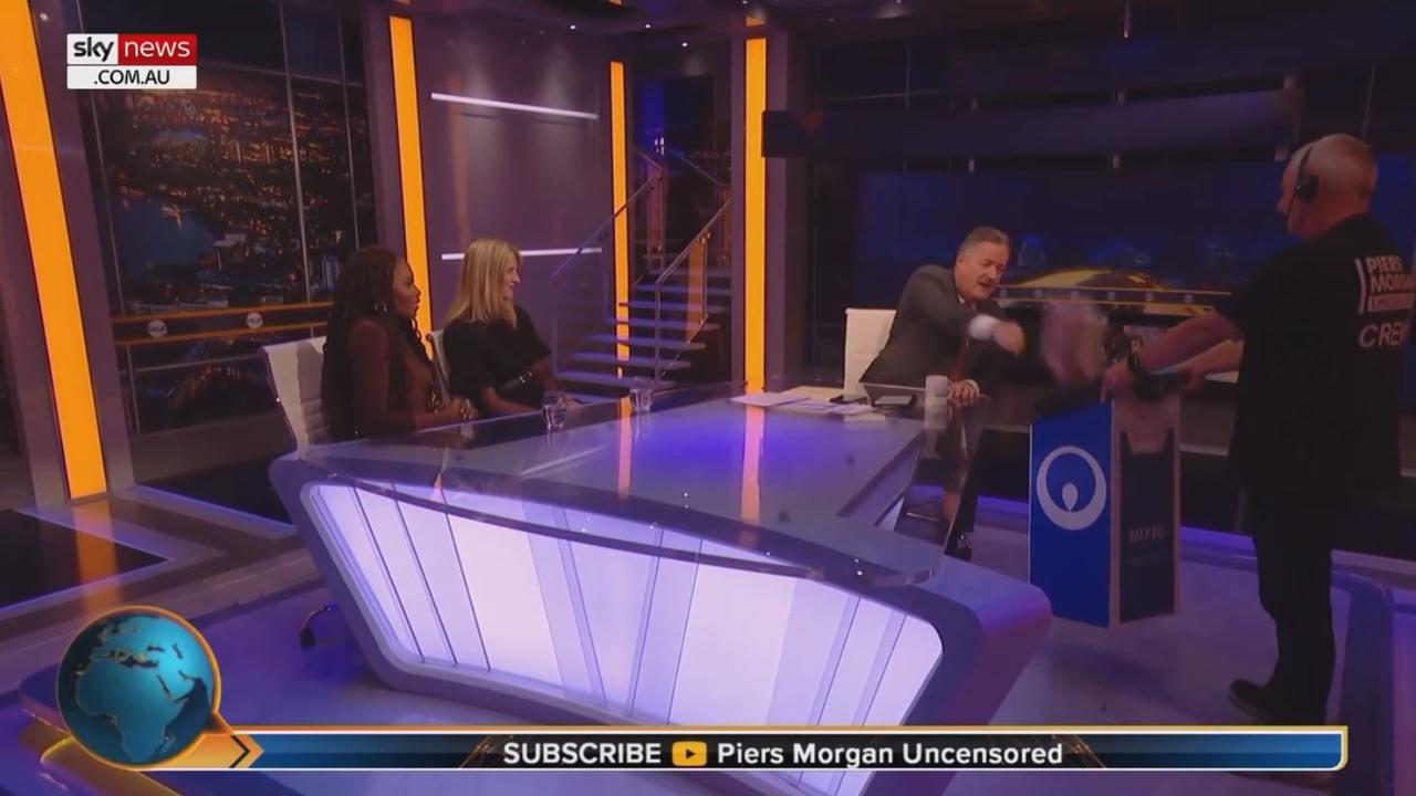 Morgan held up his copy of Spare and threw it into the bin. Picture: Sky News Australia/Piers Morgan Uncensored