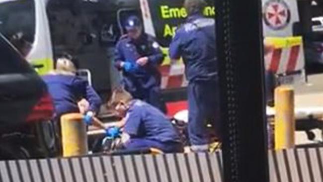 Paramedics work to save Mick Hawi after he was shot outside the Fitness First at Rockdale. Picture: Supplied