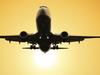 DRIP PRICING .. passenger plane fly up over take-off runway from airport at sunset