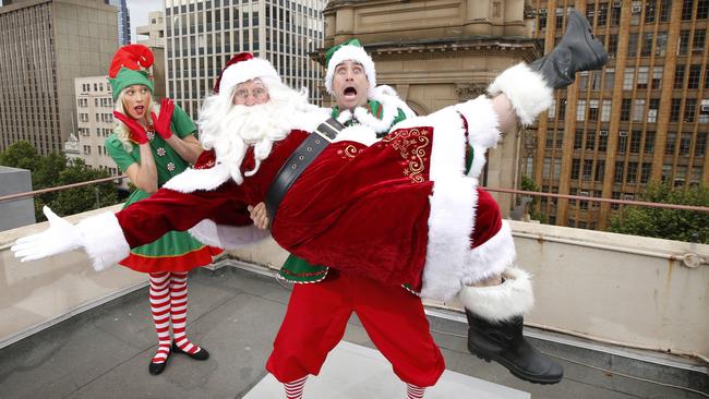 Santa with elves Eddie and Ellie on the rooftop of Town Hall. Picture: David Caird