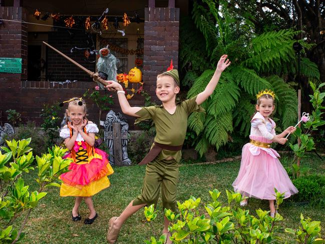 Ella as a butterfly with brother Max as Peter Pan and sister Georgie as a princess will celebrate the spooky day in their backyard.