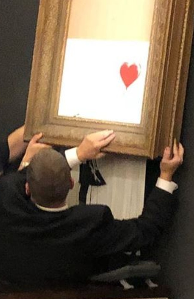 A photo of the destroyed Banksy art being taken down. Picture: Instagram/ Casterline Goodman Gallery.