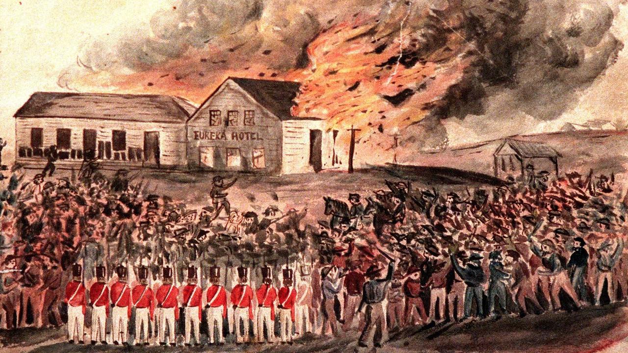 Soldiers and miners watch the Eureka Hotel burn in a historic sketch.