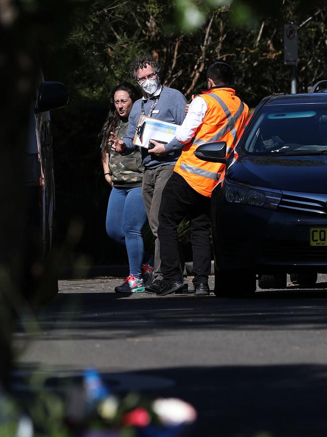 Security speaks with visitors outside Newmarch House on Sunday. Picture: Jane Dempster