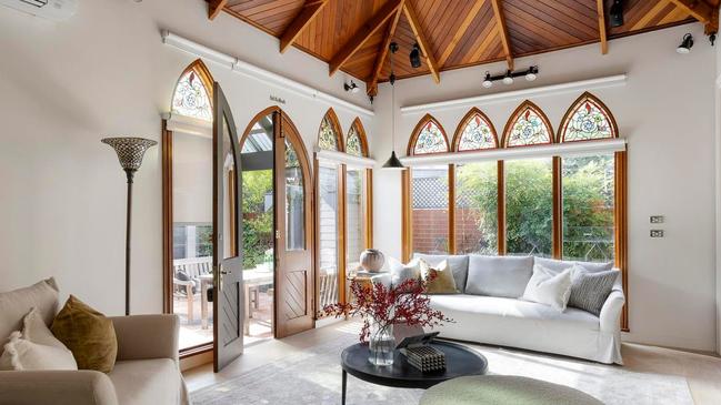 Stained glass windows, a cathedral ceiling and newly-installed wool carpets feature inside.