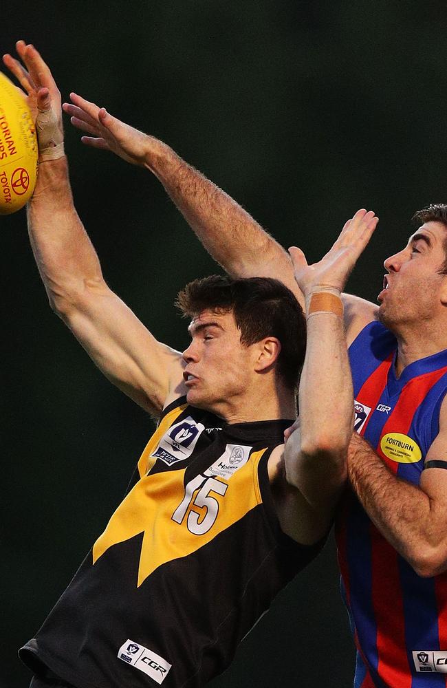 Tiger Sam Collins in an aerial contest with Jordan Lisle of Port Melbourne.