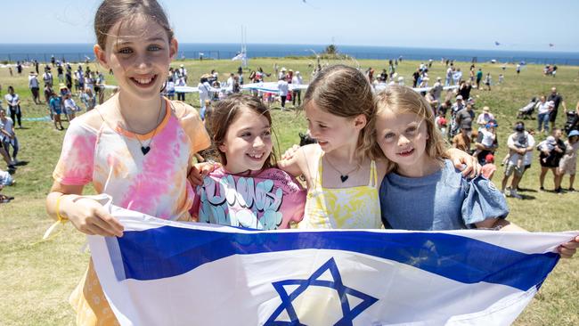 Lilah, 9, Ivy, Elly, Lyla, all seven, at the Kites for Hope event in Sydney’s eastern suburbs on Sunday. Elly reiterated calls to bring those children taken hostage home. Picture: Liam Mendes