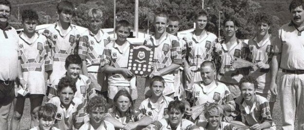James Hogan (kneeling, fourth from left) with his father, Glen Hogan (far right) at the 1997 premiership winning Gympie team. Hogan senior coached many junior teams, from Gympie right through to representative.