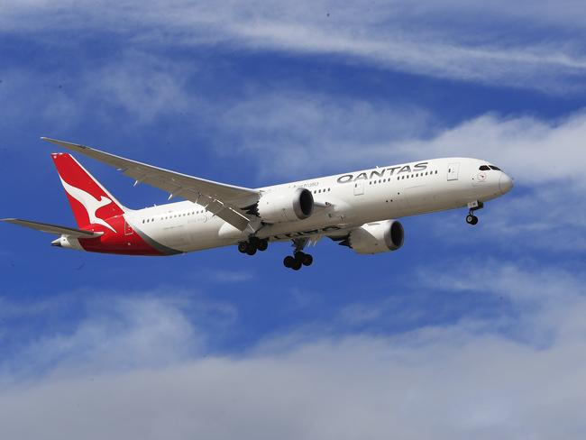 SYDNEY, AUSTRALIA - MARCH 10: A Qantas Airways jet lands at Sydney Airport on March 10, 2020 in Sydney, Australia. Qantas has cut almost a quarter of its international capacity for the next six months as travel demands fall due to fears over COVID-19. The airline today announced it was altering routes to London and would be parking eight of their 12 A380 aircraft. (Photo by Mark Evans/Getty Images)