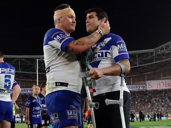 80 80 BEST OF - Injured Bulldogs captain Michael Ennis with Bulldogs Greg Eastwood after the Bulldogs loss in the South Sydney v Canterbury Bulldogs 2014 NRL Grand Final at ANZ Stadium, Sydney. Pic Brett Costello