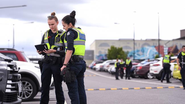 Officers from the Frontline Tactical unit and Proactive Policing units in the carpark at Fountain Gate in Narre Warren. Casey and Dandenong are hot spots for vehicle crime. Constables Emma Whitfield and Brittany Adcock were doing checks on cars. PICTURE: PENNY STEPHENS. THURSDAY 20TH FEBRUARY 2020