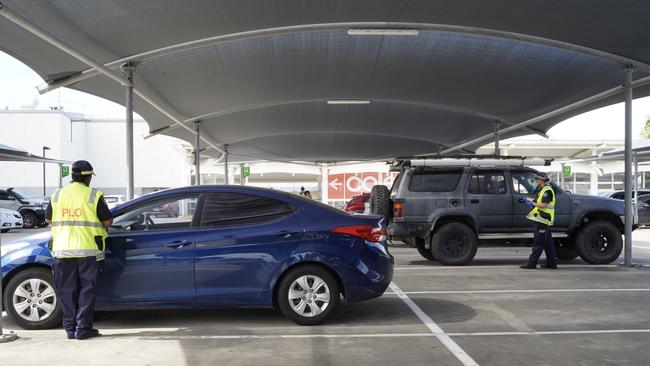 Caneland Central Police Beat Senior Liaison Officer Stacey Quakawoot with Acting Senior Constable Kate Ward checking for unlocked cars at the shopping centre as part of Queensland Police Service's 