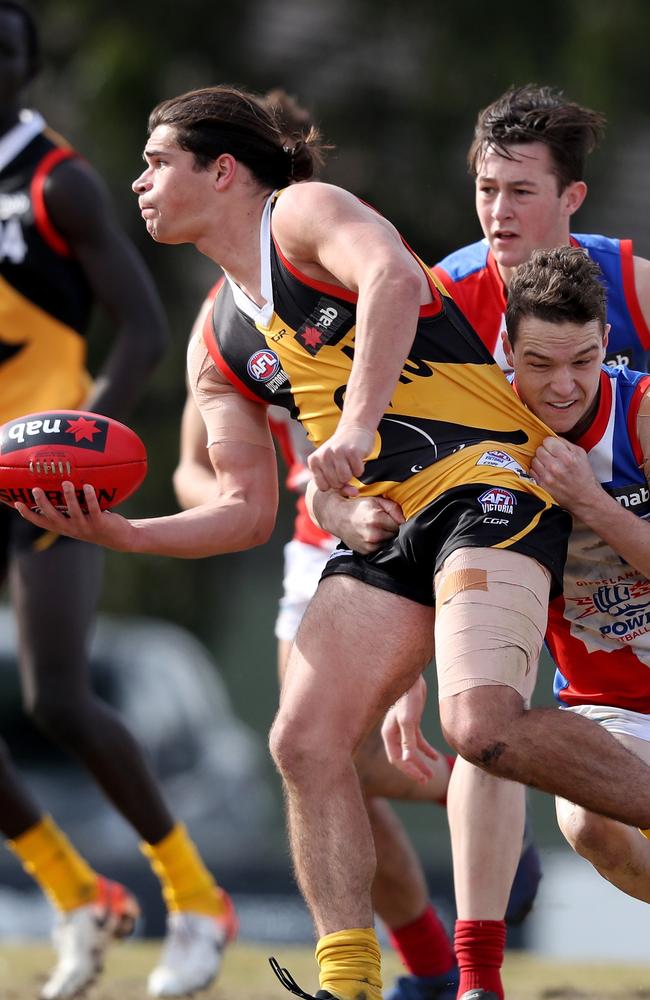 Riley Baldi tackles Luca Goonan in a NAB League game last year. Both have linked with Casey Demons.