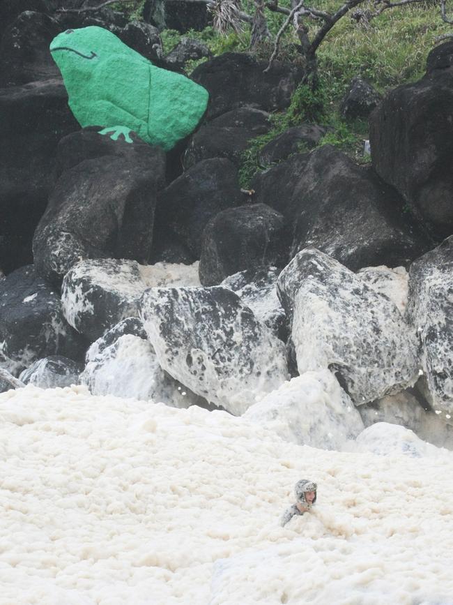 The froggy rock overlooks swimmers at Froggies Beach.