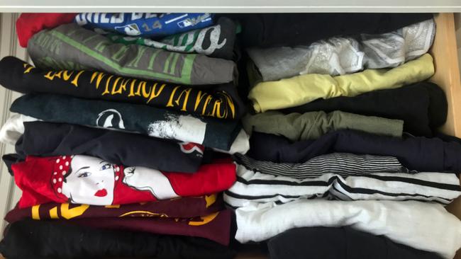 T-shirts are seen "filed" in a drawer using the KonMari method. Picture: AFP