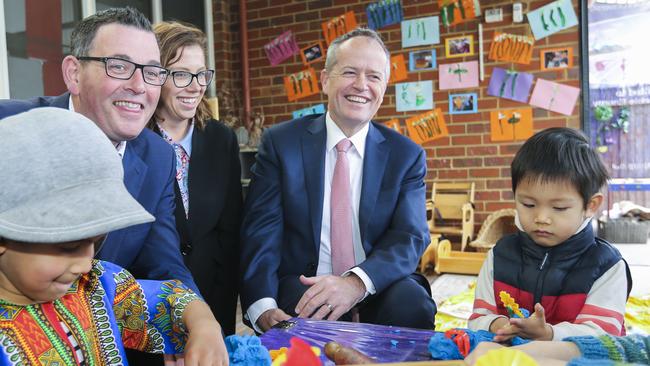 Opposition Leader Bill Shorten (centre) and Victorian Premier Daniel Andrews (second left) are seen during a visit to a preschool in Melbourne, Thursday, October 4, 2018. Labor have made a major kindergarten funding announcement. (AAP Image/Wayne Taylor) NO ARCHIVING