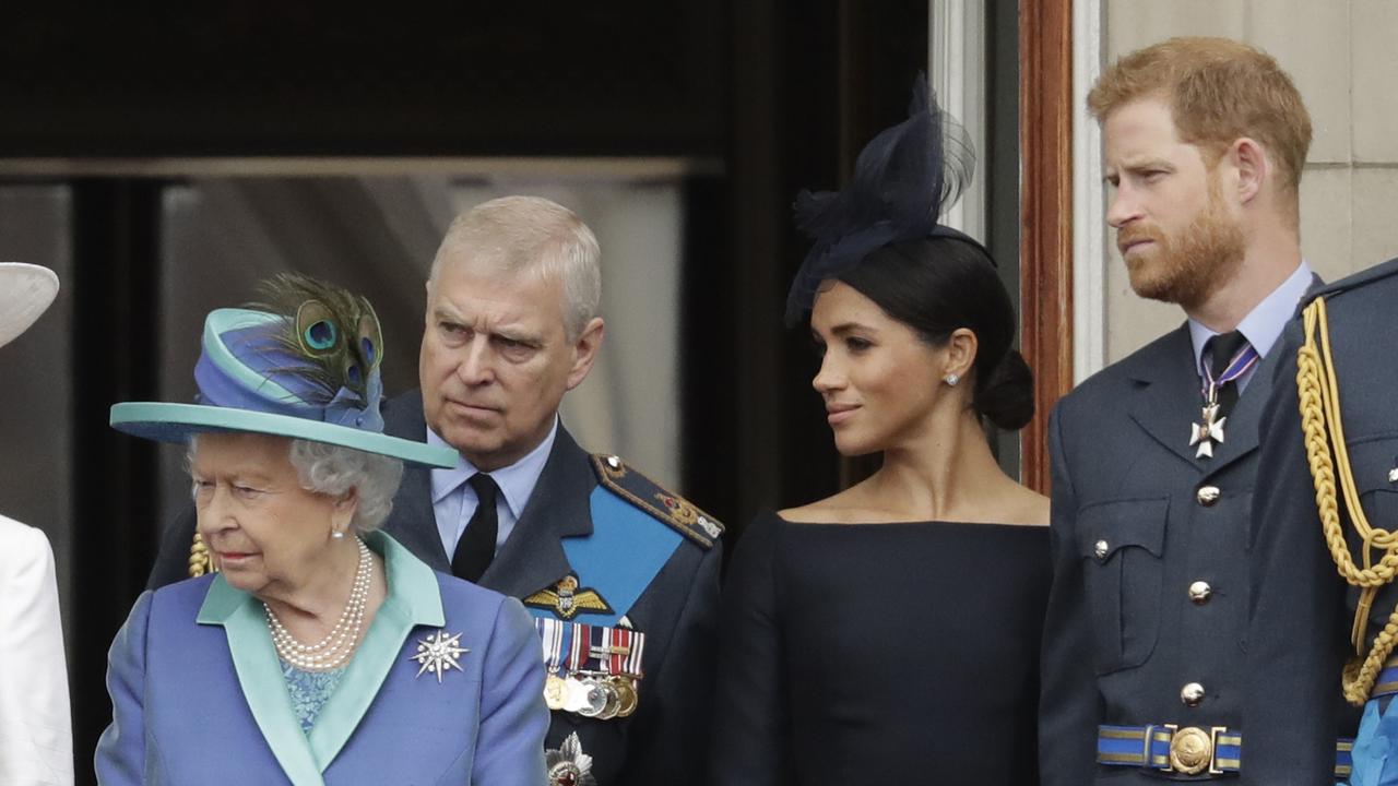 In this Tuesday, July 10, 2018 file photo Britain's Queen Elizabeth II, Prince Andrew, Meghan the Duchess of Sussex and Prince Harry stand on a balcony to watch a flypast of Royal Air Force aircraft pass over Buckingham Palace in London. Picture: AP/Matt Dunham