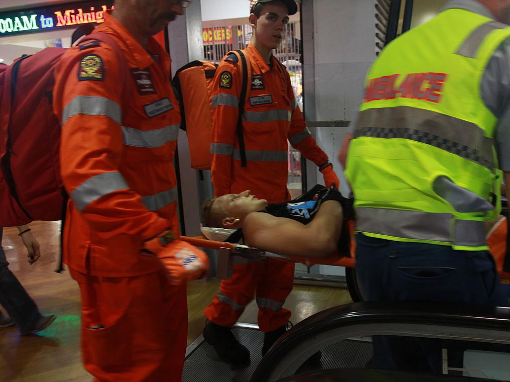 2014 Schoolies on the Gold Coast. A schoolie is knocked unconscious at the timezone amusement arcade in cavill ave mall. Picture: Marc Robertson