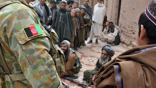 Australian Army soldiers from Special Operations Task Group meet with Gizab villagers in Uruzgan province, southern Afghanistan, after joining forces to fight local Taliban insurgents. Picture: Department of Defence