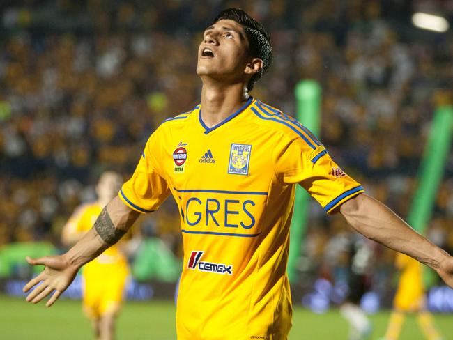 Pulido celebrates after scoring for Tigres against Atlas in Mexican football.