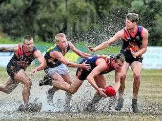 Noosa Tiger Adam Eady tries to control the ball in wet conditions at Weyba Road yesterday during the derby against Maroochy-Northshore. Picture: Geoff Potter