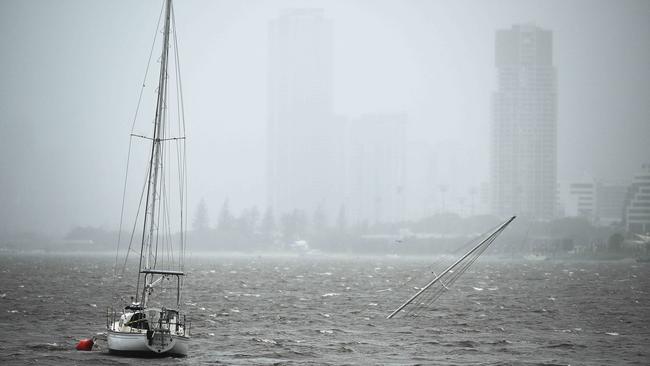 A yacht is submerged with only its mast visible at Broadwater on the Gold Coast. Picture: Lyndon Mechielsen